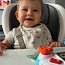 Beau joined the competition — help win amazing prizes! baby, bib, child, clothing, face, feeding, furniture, happy, high_chair, home, indoor, infant, pacifier, person, playful, seatbelt, smiling, table, toy, white