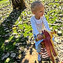 Alma participe au concours pour gagner de l'argent avec cette photo : autumn, casual_clothing, child, daytime, fun, grass, happy, jeans, leaves, outdoor, play, playground, shadows, smiling, sneakers, spring_rocker, sunlight, toddler, tree, white_shirt