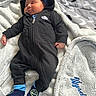 Wysdom is registered to the contest to win money with this photo: baby, sleeping, onesie, nike, blue_socks, smiley_face, blanket, quilt, bed, cozy, infant, child, soft_texture, resting, cute, indoor, clothing, comfort, peaceful, portrait