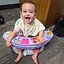 Avaya joined the competition — help win amazing prizes! baby, child, smiling, happy, sitting, toy, activity_seat, purple, carpet, indoor, cabinet, wood, clothing, bib, footwearless, face, person, play, baby_toys, earrings
