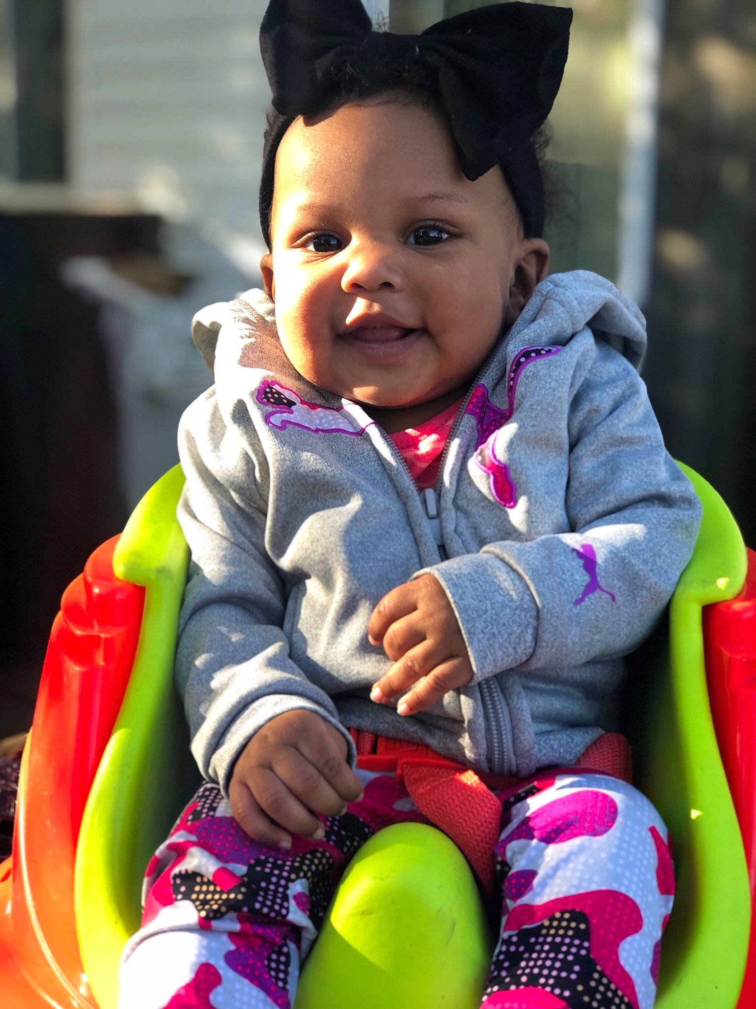 Adilynn is registered to the contest to win money with this photo: baby, baby_carriage, baby_products, beauty, black_hair, cheek, child, ear, eye, face, fun, happy, outerwear, people, person, pink, play, product, skin, smile