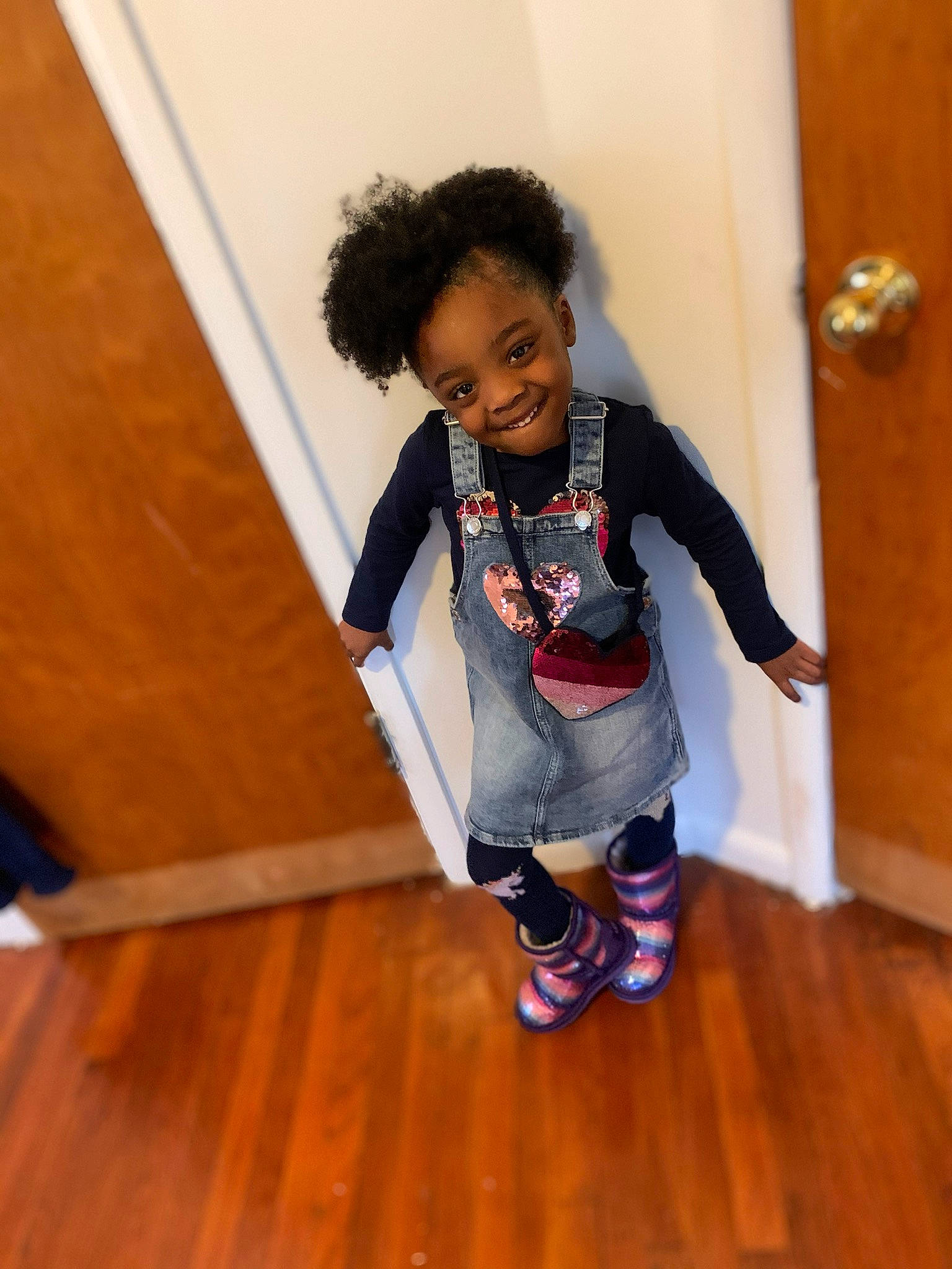 Zariah is registered to the contest to win money with this photo: child, floor, flooring, fun, hardwood, joy, laminate_flooring, person, play, shoe, standing, toddler, wood