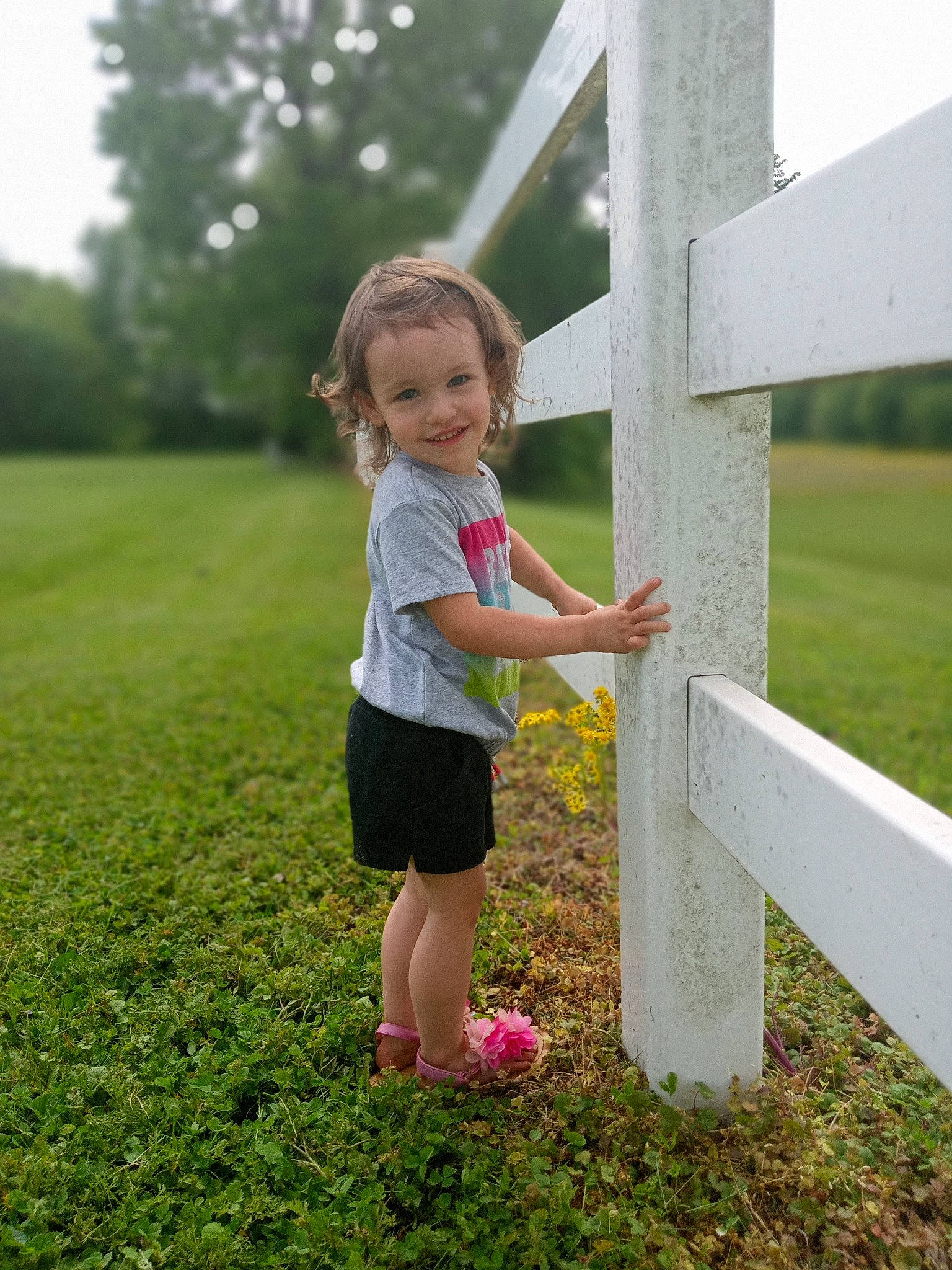 Jade joined the competition — help win amazing prizes! baby_toddler_clothing, fun, grass, grass_family, grassland, happy, joy, leaf, leg, leisure, meadow, natural_environment, nature, people_in_nature, person, plant, shorts, sky, standing, sunlight