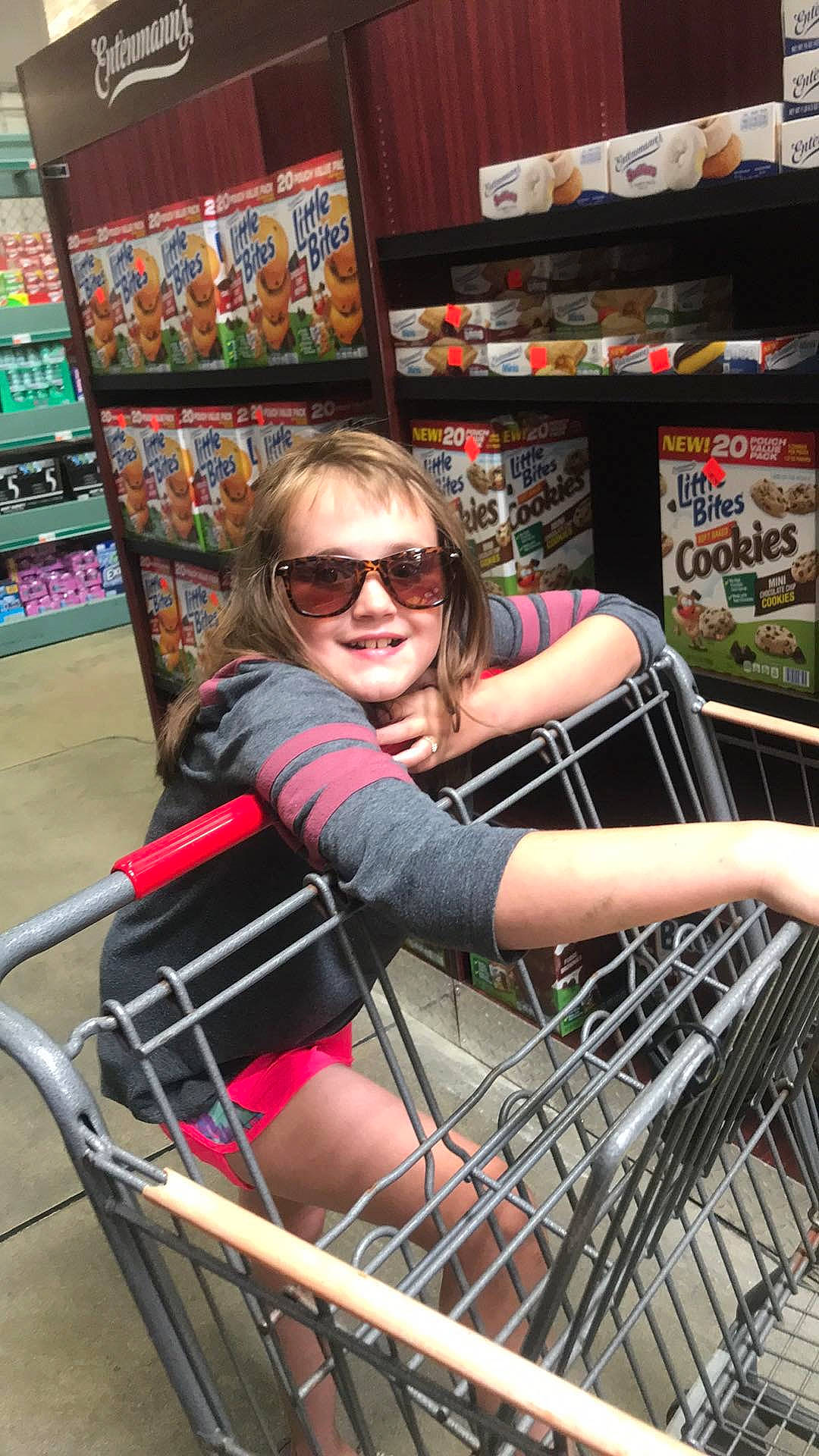 Madisyn is registered to the contest to win money with this photo: basket, building, cart, fun, glasses, grocery_store, joy, leg, leisure, person, product, retail, shopping, shopping_cart, smile, supermarket, vacation, vehicle