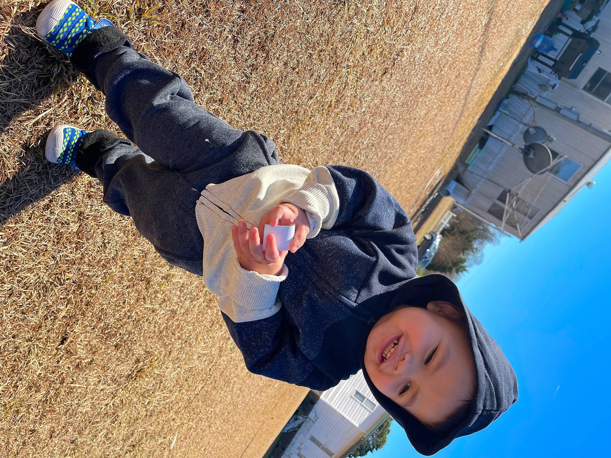 Carlos is registered to the contest to win money with this photo: child, city, electric_blue, fun, gesture, happy, headwear, human_leg, joy, landscape, leisure, people_in_nature, person, recreation, shadow, sky, smile, soil, toddler, tourism