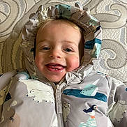 Clark joined the competition — help win amazing prizes! animal_print, baby, child, closeup, cute, face, hooded_jacket, indoor, infant, patterned_background, playful, polar_bear, portrait, puffin, seal, smiling, tongue_out, warm_clothing, winter_clothing, zipper