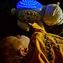 Kivers participe au concours pour gagner de l'argent avec cette photo : child, sleeping, yellow_shirt, toy, bear, light, blue_light, night, dark, cozy, bedtime, soft_toy, face, ear, head, person, indoors, calm, rest, quiet