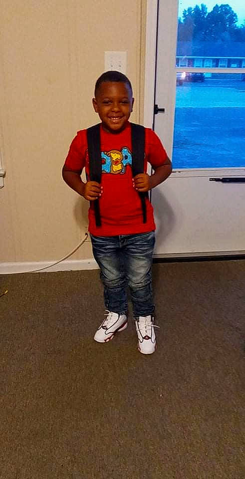 Micah is registered to the contest to win money with this photo: child, event, flooring, fun, happy, jeans, joy, leisure, person, recreation, room, sleeve, smile, t_shirt, vacation, visual_arts, water