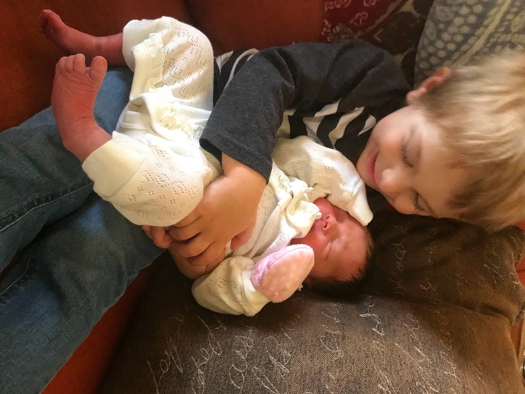 Craig is registered to the contest to win money with this photo: abdomen, baby, baby_toddler_clothing, cheek, child, comfort, elbow, finger, foot, gesture, hand, human_leg, knee, lap, nail, person, sitting, skin, thumb, toddler