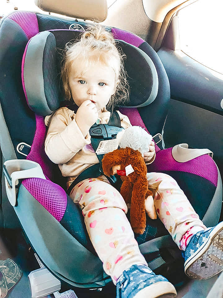 Harper joined the competition — help win amazing prizes! baby_carriage, baby_products, car_seat, car_seat_cover, child, girl, person, product, sitting, toddler