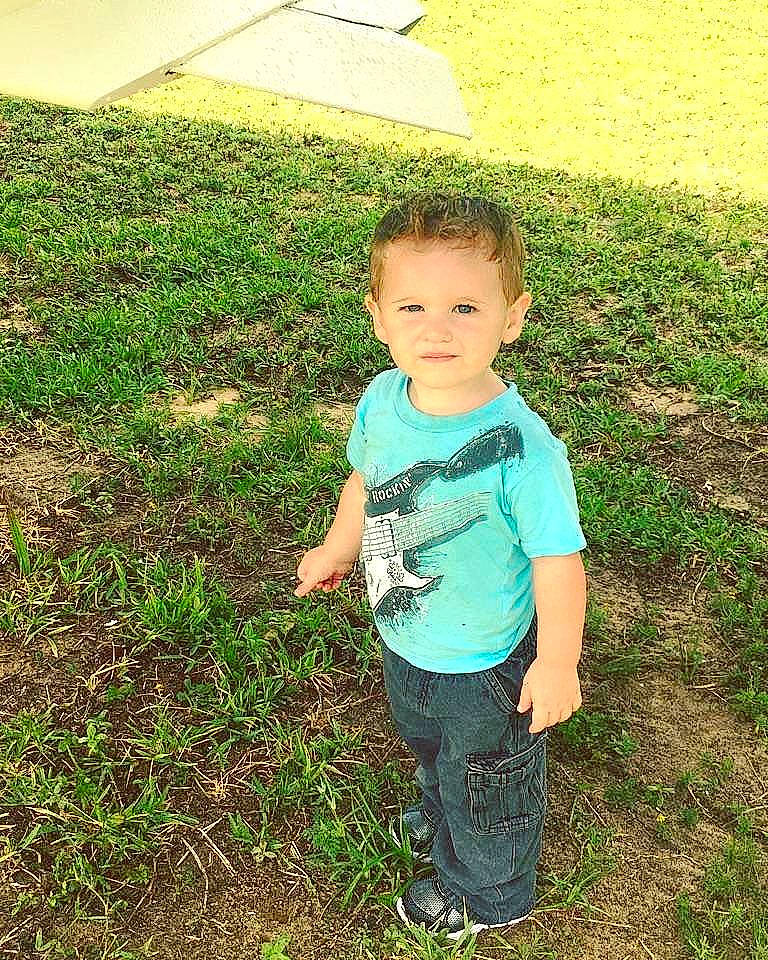 Aiden is registered to the contest to win money with this photo: boy, child, day, fun, grass, grass_family, green, lawn, leaf, male, meadow, person, plant, play, smile, soil, standing, summer, toddler, tree