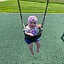 Raylynn is registered to the contest to win money with this photo: baby, child, swing, playground, headband, outdoor, grass, greenery, sunny, summer, park, infant, cute, toddler, clothing, footwearless, seat, toy, nature, people