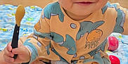 Kingsley is registered to the contest to win money with this photo: toddler, child, smiling, indoor, floor, toy, blanket, fruit, vegetable, play, cute, onesie, spoon, happy, sitting, colorful, face, hair, hand, foot