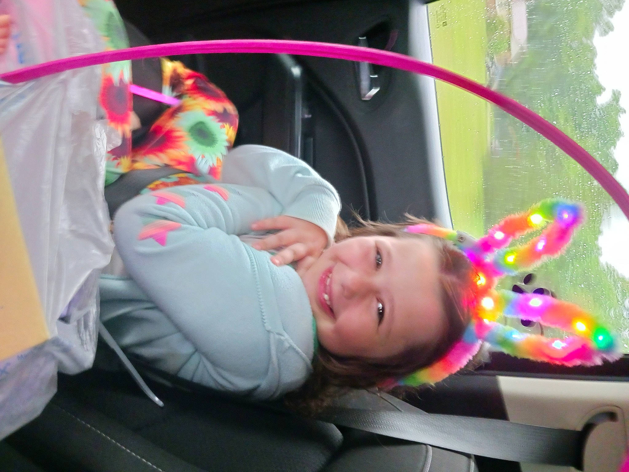 Jaimee is registered to the contest to win money with this photo: auto_part, automotive_wheel_system, baby, baby_products, child, event, fun, grass, joy, leisure, magenta, motor_vehicle, person, pink, plant, recreation, smile, tire, toddler, toy