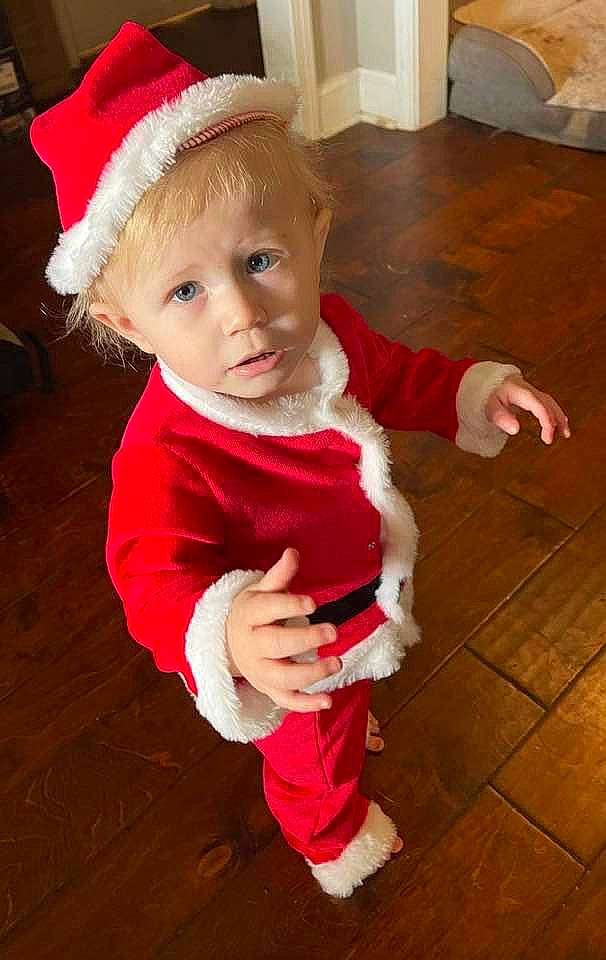 Kason joined the competition — help win amazing prizes! baby, baby_toddler_clothing, child, christmas, christmas_eve, costume_hat, event, floor, flooring, fun, fur, happy, hardwood, holiday, person, sitting, sleeve, toddler, wood, wood_flooring