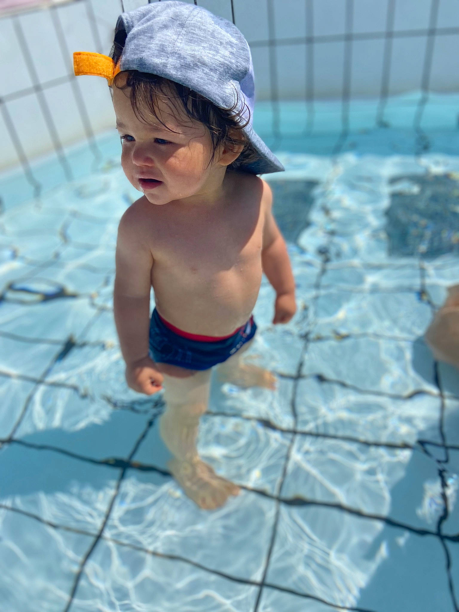 Daymon a rejoint le concours — aidez-le/la à gagner de superbes lots ! azure, baby, barefoot, baseball_cap, bathing, cap, electric_blue, flooring, fun, happy, human_leg, leisure, person, recreation, summer, swimming_pool, swimwear, thigh, toddler, underpants