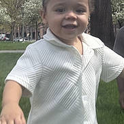 Rey is registered to the contest to win money with this photo: toddler, child, smiling, outdoor, grass, tree, park, daylight, happy, person, clothing, white_shirt, nature, playing, young_child, portrait, casual, cute, baby, fun
