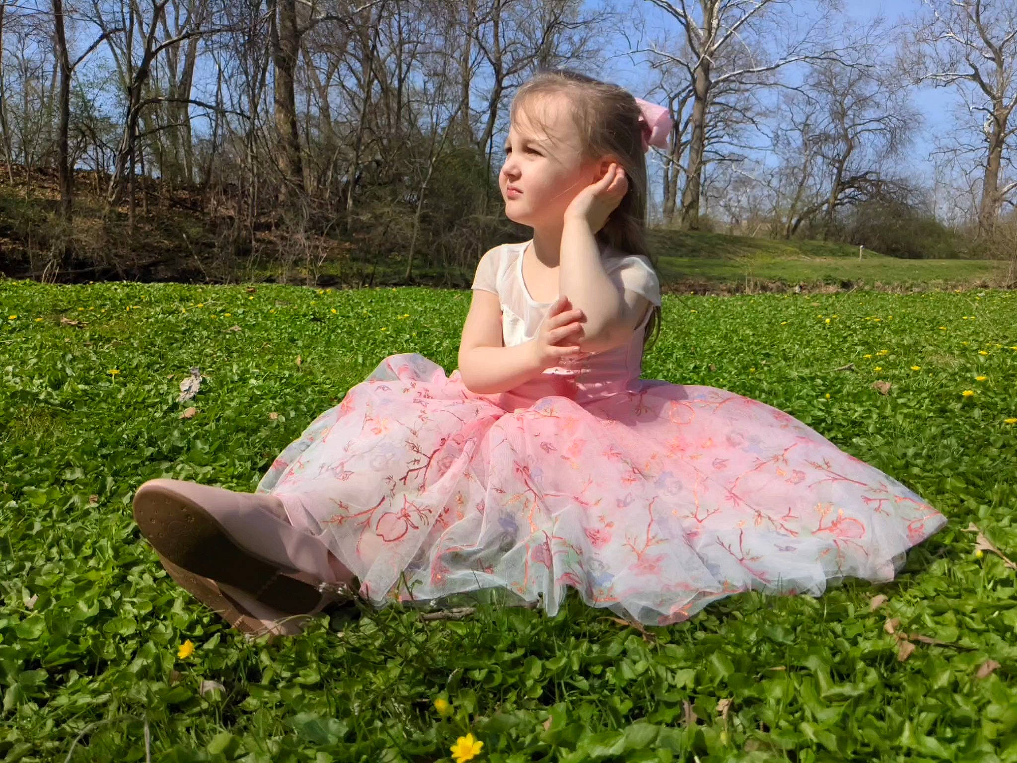 River is registered to the contest to win money with this photo: baby_toddler_clothing, blond, dress, event, face, fun, grass, grassland, happy, head, lawn, leaf, meadow, people_in_nature, person, petal, pink, plant, sky, toddler