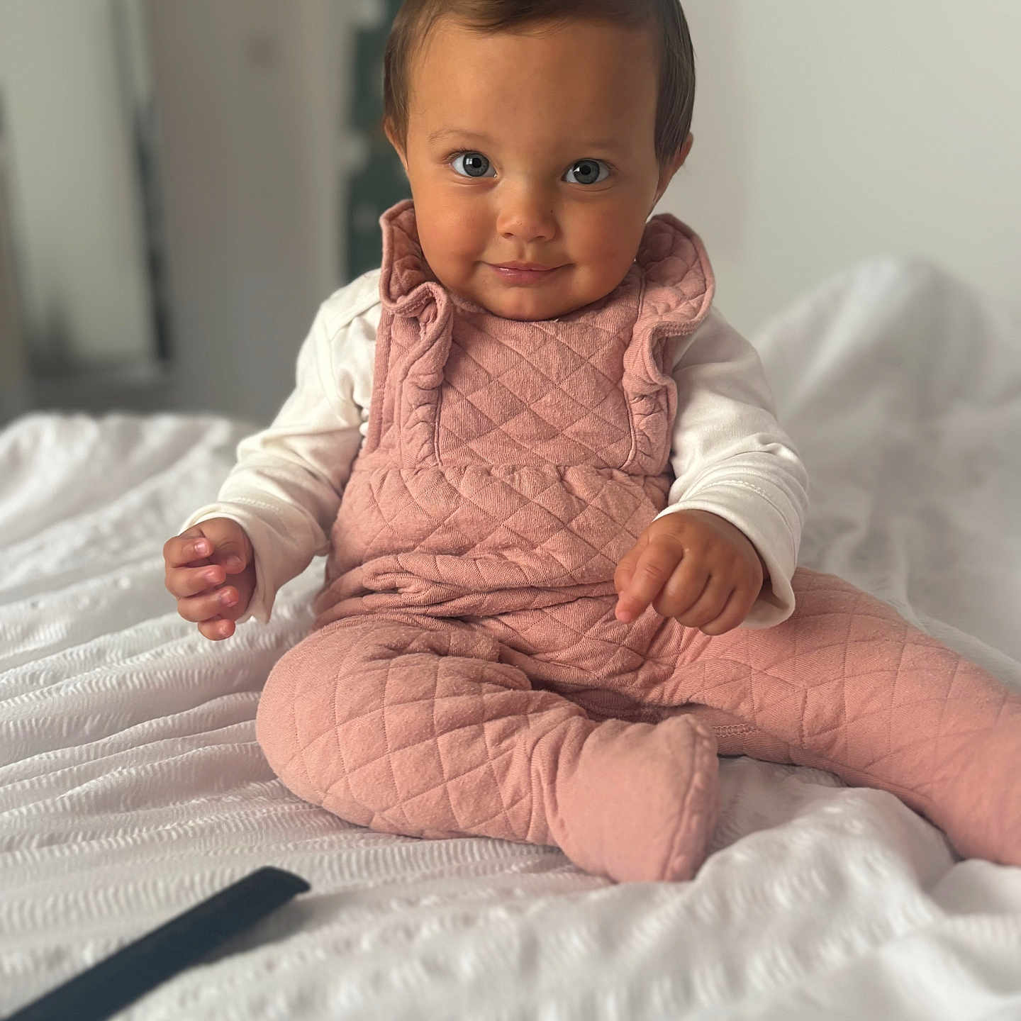 Remi joined the competition — help win amazing prizes! baby, blanket, bodypart, clothing, dress, face, finger, formalwear, hand, happy, head, longsleeve, pants, person, photography, portrait, quilt, sitting, sleeve, smile