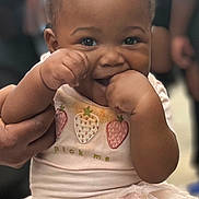 Ariyah is registered to the contest to win money with this photo: baby, child, clothing, cute, face, fashion, hair_buns, hand, happy, holding, indoor, infant, leggings, people, person, pink, playful, portrait, smiling, tutu