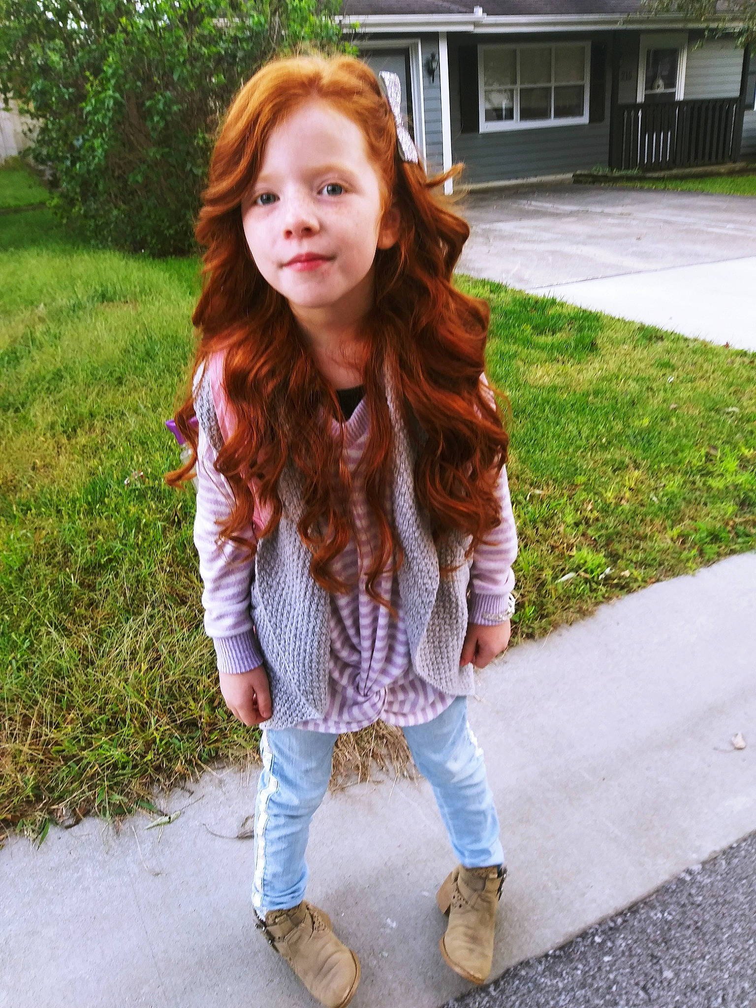 Emry is registered to the contest to win money with this photo: beauty, brown, brown_hair, child, child_model, clothing, fashion, footwear, hair, hair_coloring, hairstyle, jeans, leg, lip, long_hair, outerwear, person, red_hair, shoe, smile