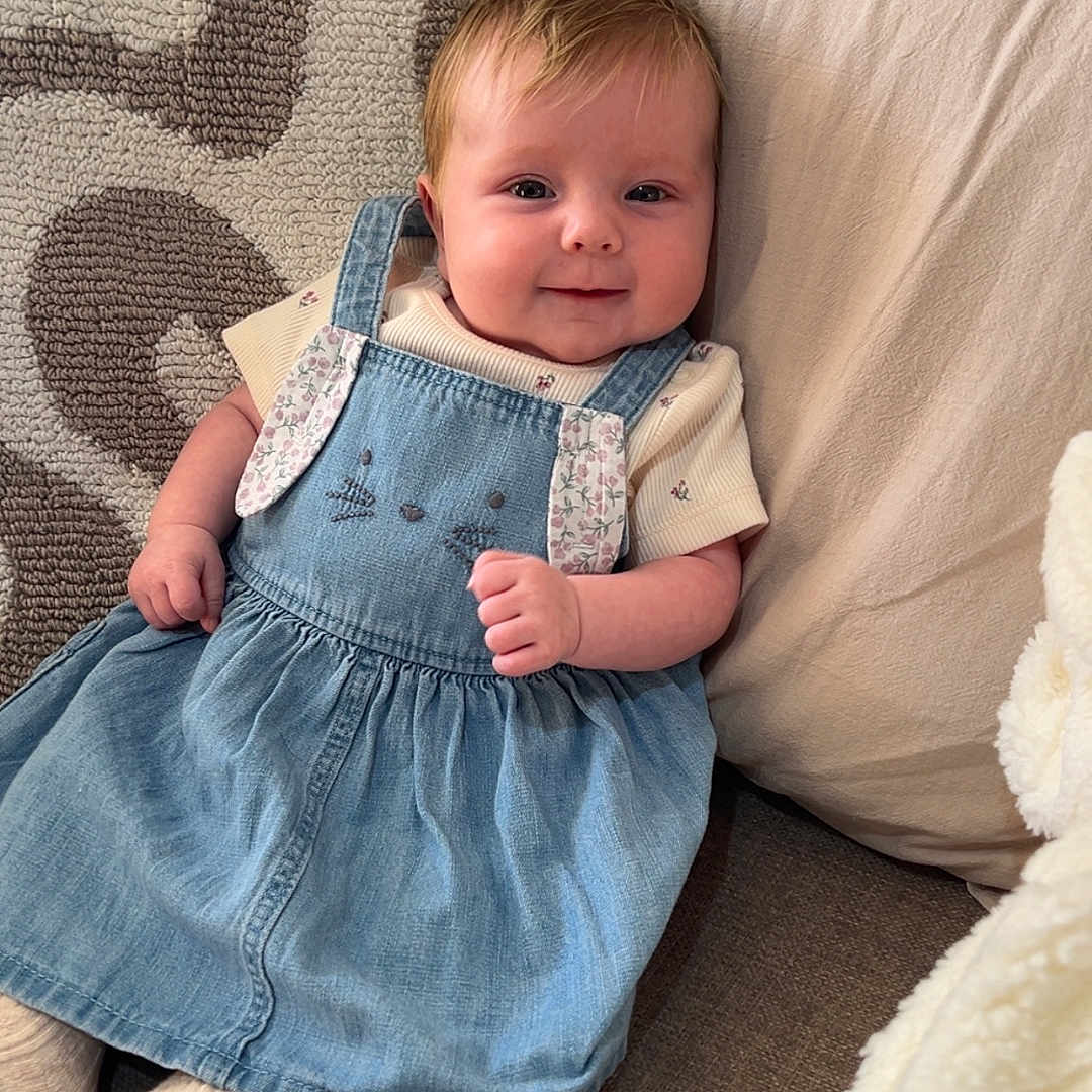 Nelly joined the competition — help win amazing prizes! baby, bodypart, clothing, couch, cushion, dress, face, finger, furniture, head, homedecor, hosiery, jeans, linen, pants, person, photography, portrait, sitting, sock