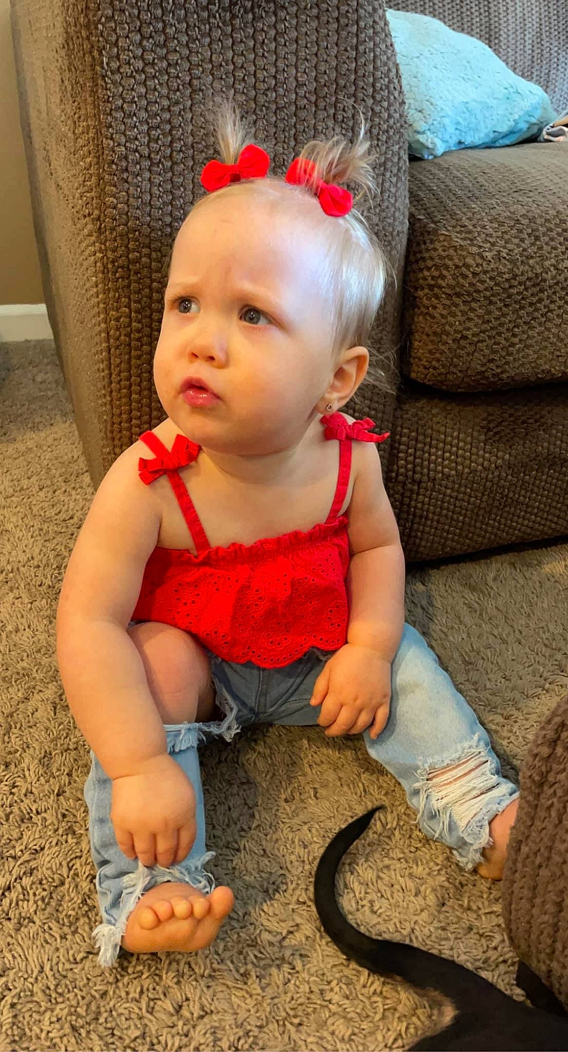 Hensley is registered to the contest to win money with this photo: baby, baby_toddler_clothing, cheek, child, costume_hat, eye, facial_expression, flooring, foot, fun, happy, head, headband, human, nose, organ, pattern, person, sitting, skin