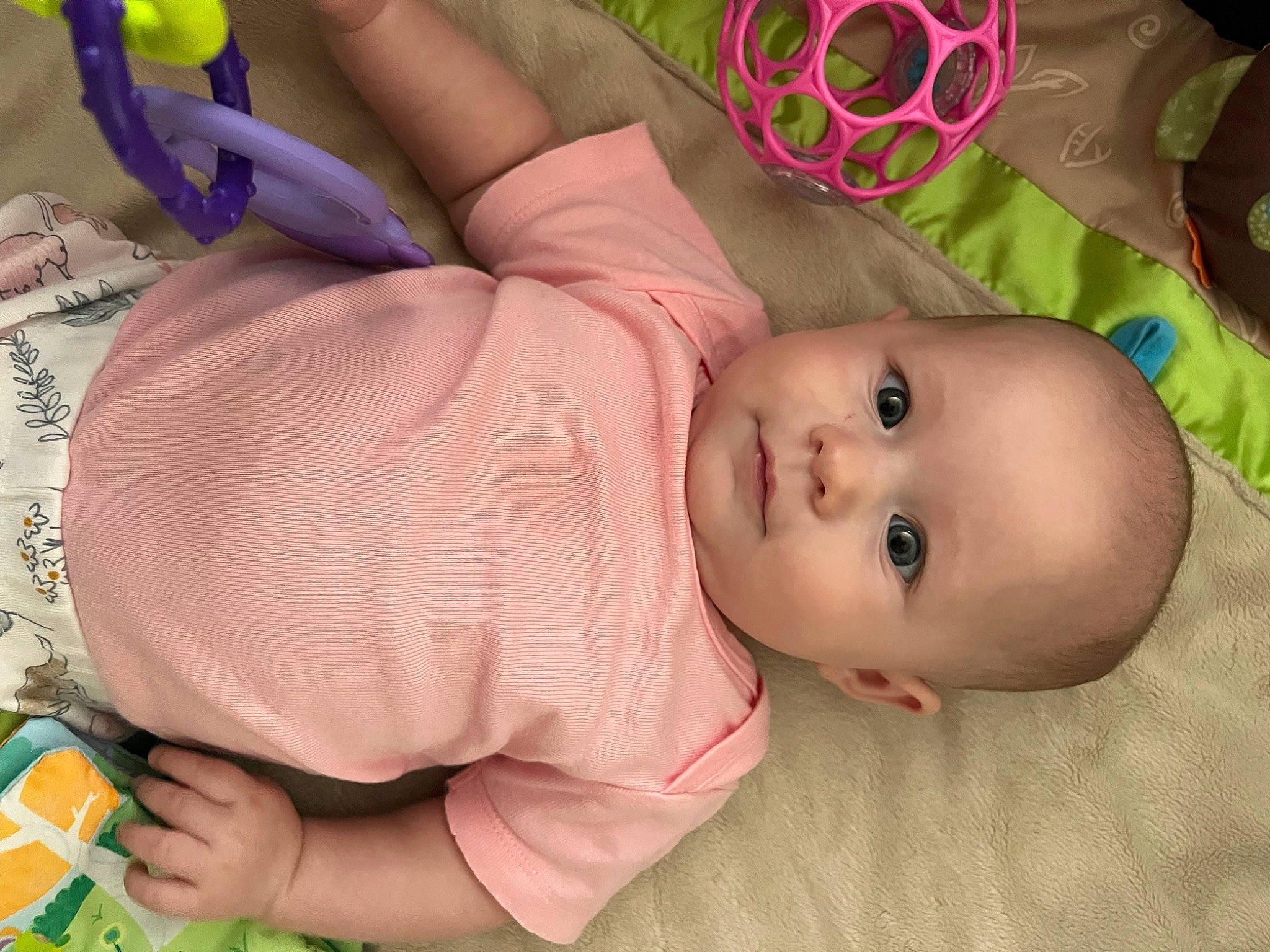 Evelynn joined the competition — help win amazing prizes! arm, baby, baby_products, baby_toddler_clothing, cheek, child, face, finger, green, head, iris, lip, mouth, nose, pattern, person, pink, product, skin, textile