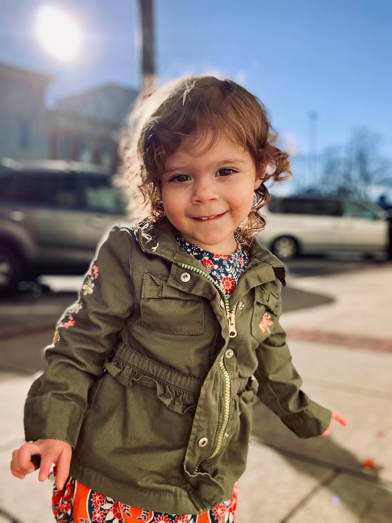 Joanna is registered to the contest to win money with this photo: car, eye, happy, iris, joy, outerwear, people, person, photograph, skin, sky, sleeve, smile, standing, street_fashion, summer, sunlight, tire, toddler, travel