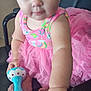 Heavenly is registered to the contest to win money with this photo: baby, child, tutu, pink_clothing, headband, rattle, toy, chair, leather, hand, foot, cute, indoor, portrait, infant, colorful, playful, sitting, person, young