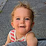 toddler, child, smiling, face, blue_eyes, hair, outdoor, pavement, striped_clothing, sleeveless, cute, happy, baby, person, portrait, skin, cheeks, daylight, casual, curious