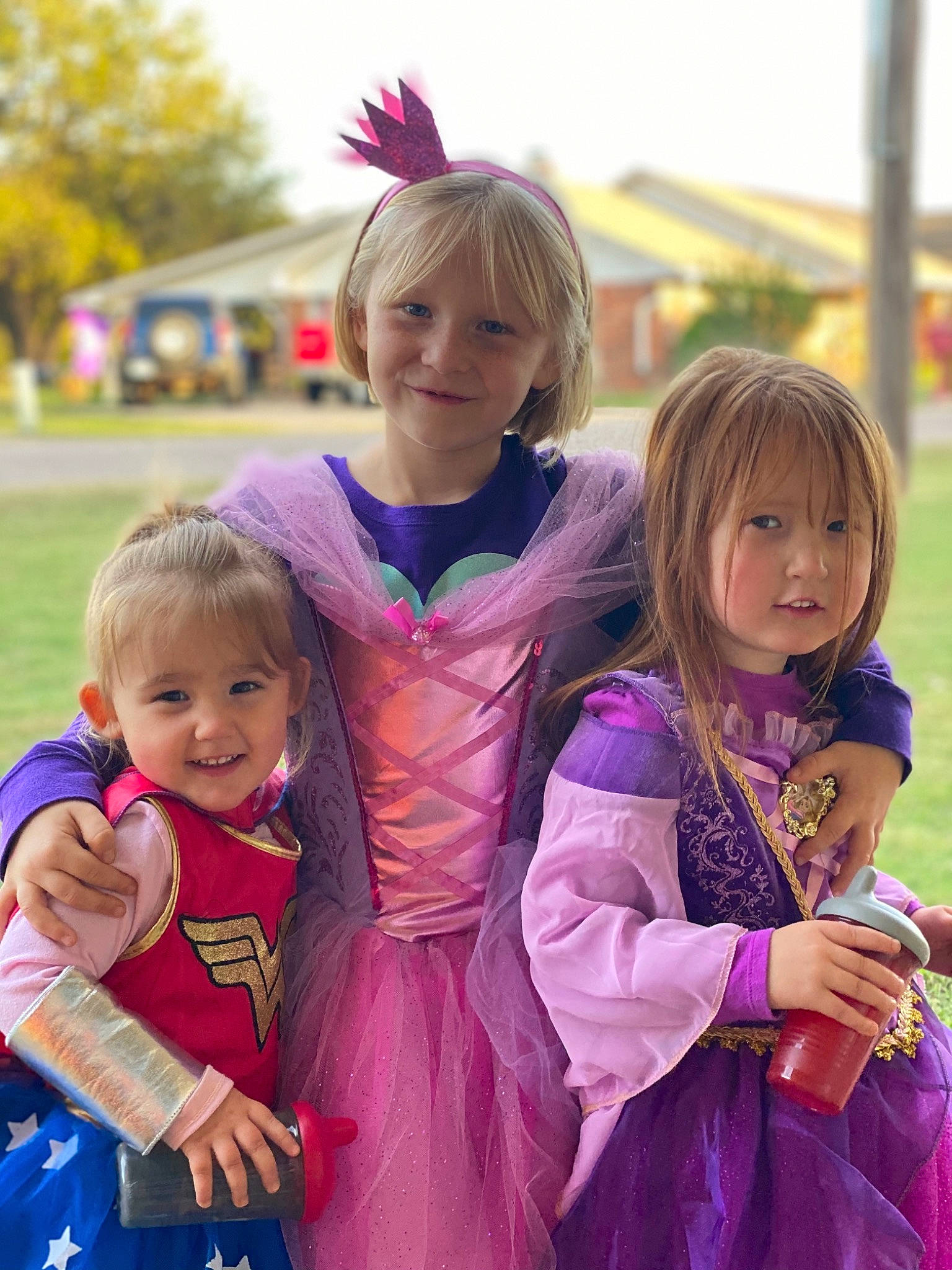 Loretta is registered to the contest to win money with this photo: eye, facial_expression, friendship, fun, gesture, grass, hair, hairstyle, happy, interaction, iris, joy, people, person, pink, purple, skin, smile, summer, toddler