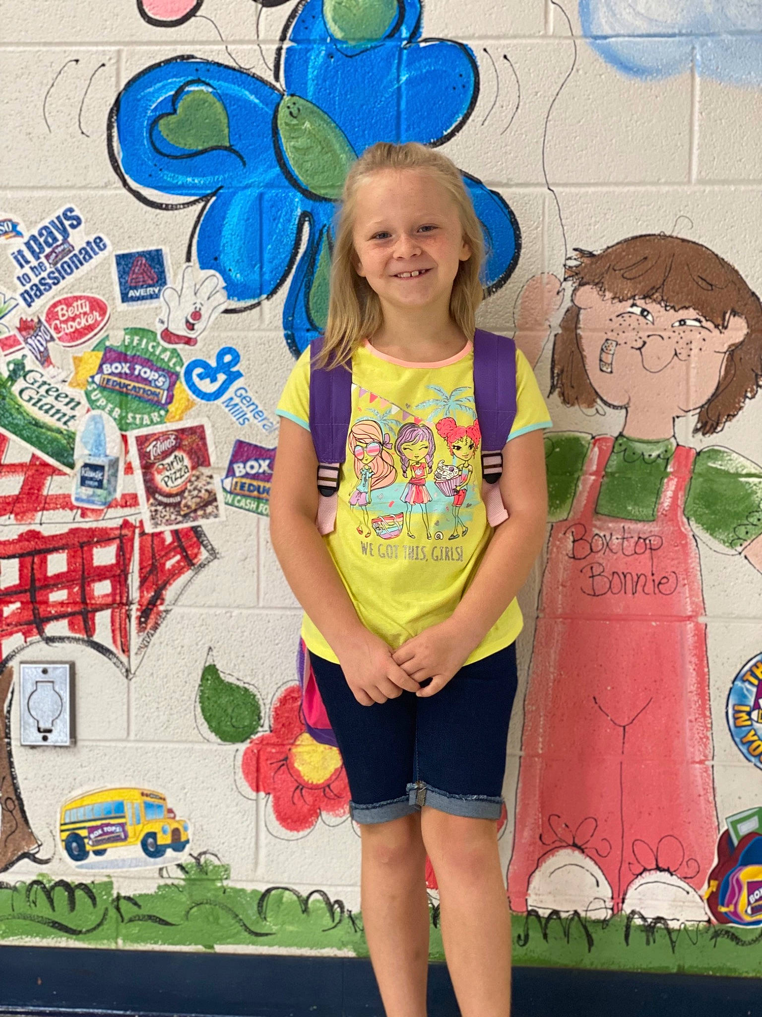 Loretta is registered to the contest to win money with this photo: art, blue, child, event, facial_expression, fun, green, happy, joy, leisure, pattern, person, pink, shorts, smile, social_group, style, summer, t_shirt, textile