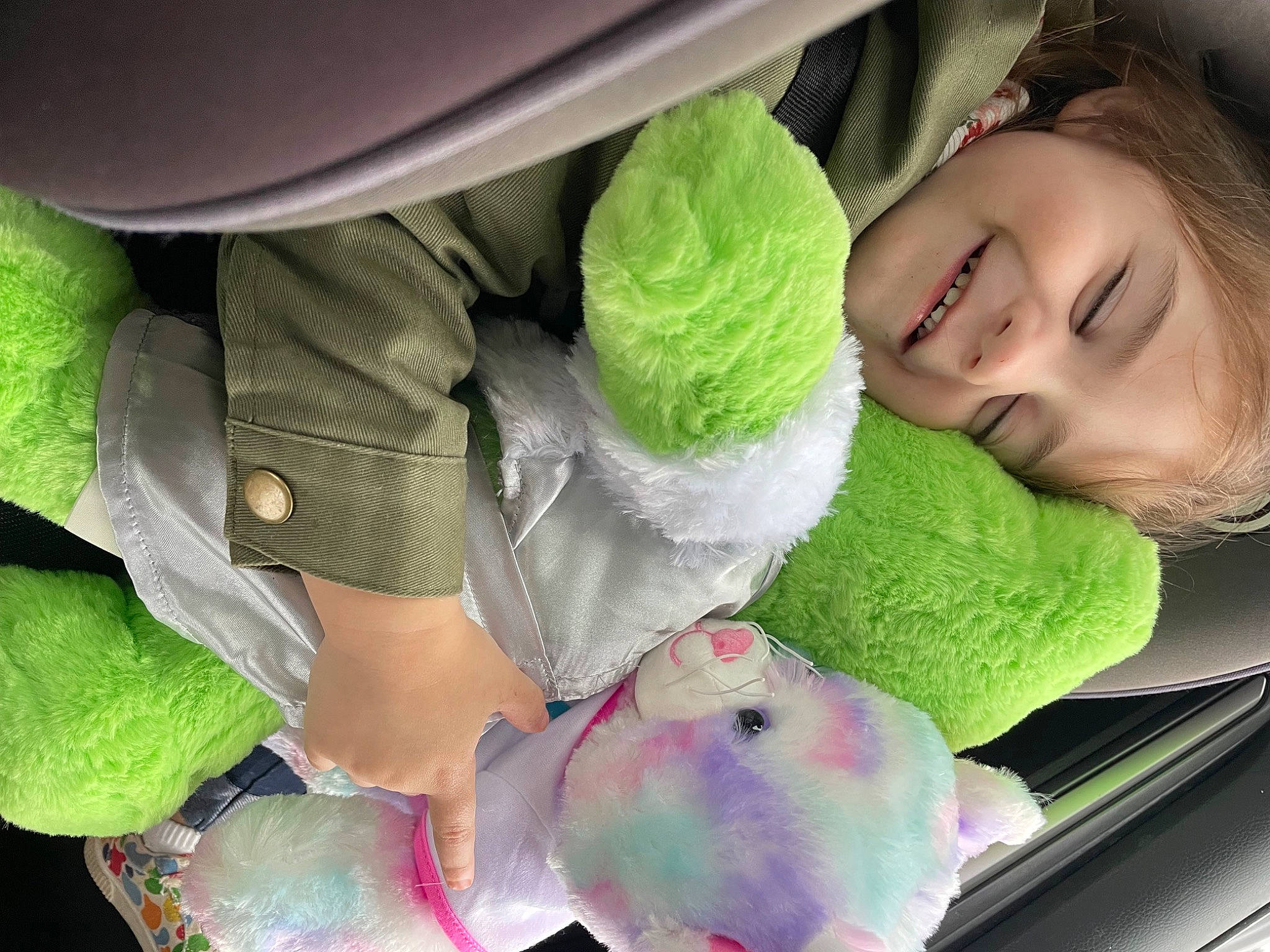 Audrianna joined the competition — help win amazing prizes! baby_products, car_seat, child, comfort, family_car, fashion_accessory, green, happy, joy, linens, magenta, pattern, person, petal, plastic, plush, smile, stuffed_toy, textile, toddler