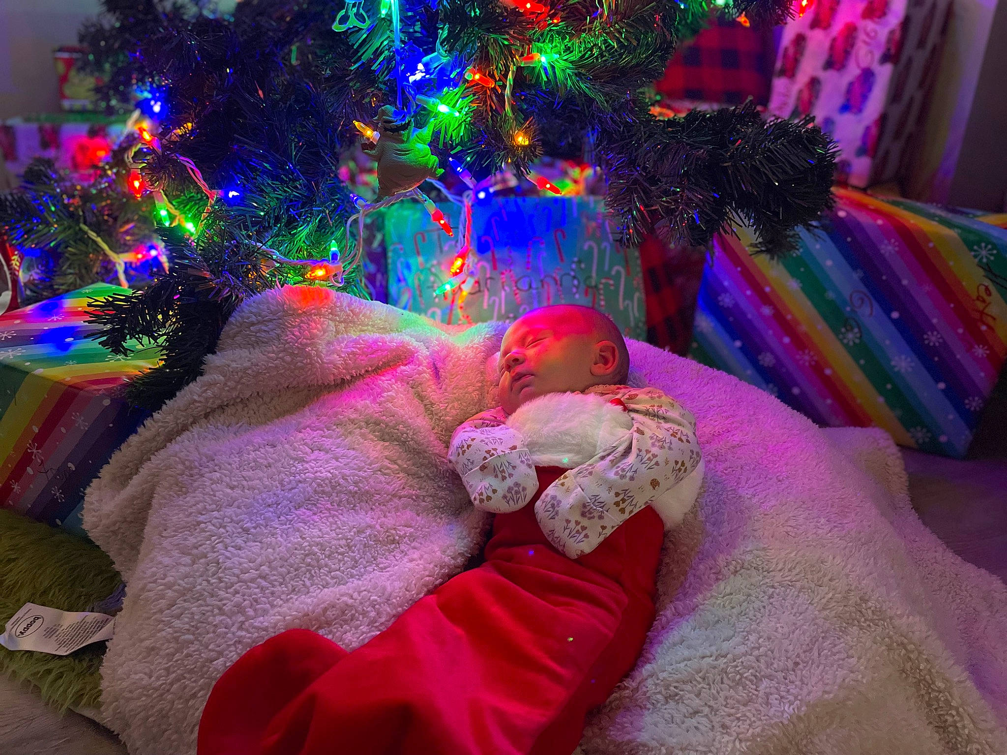 Heather joined the competition — help win amazing prizes! baby, baby_toddler_clothing, christmas_decoration, christmas_ornament, christmas_tree, comfort, conifer, decoration, event, fun, holiday, lap, magenta, ornament, person, pink, purple, room, toddler, tree