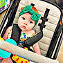 Alina is registered to the contest to win money with this photo: baby, stroller, headband, toy, child, blue_eyes, red_hair, seatbelt, shopping, store, colorful, infant, clothing, indoor, cute, portrait, curious, plastic_toys, sitting, baby_boy