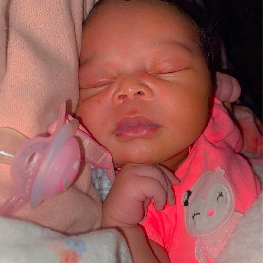 Ariah Smith joined the competition — help win amazing prizes! architecture, baby, bed, blanket, bodypart, building, clothing, cushion, face, finger, furniture, glove, hand, head, homedecor, newborn, person, photography, portrait, sleeping