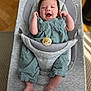baby, smiling, infant, child, green_outfit, corduroy, ergobaby, baby_seat, indoor, happy, cute, person, small_hands, feet, face, expression, comfort, seated, light, cozy