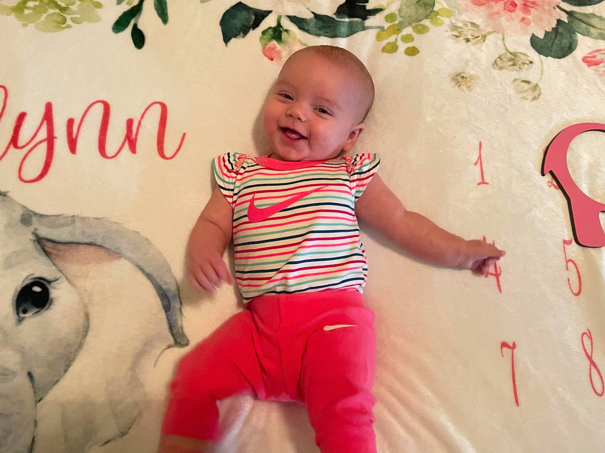 Raelynn is registered to the contest to win money with this photo: baby, baby_toddler_clothing, beauty, child, fun, happy, joy, magenta, people, people_in_nature, person, photograph, pink, product, red, skin, sleeve, smile, standing, t_shirt
