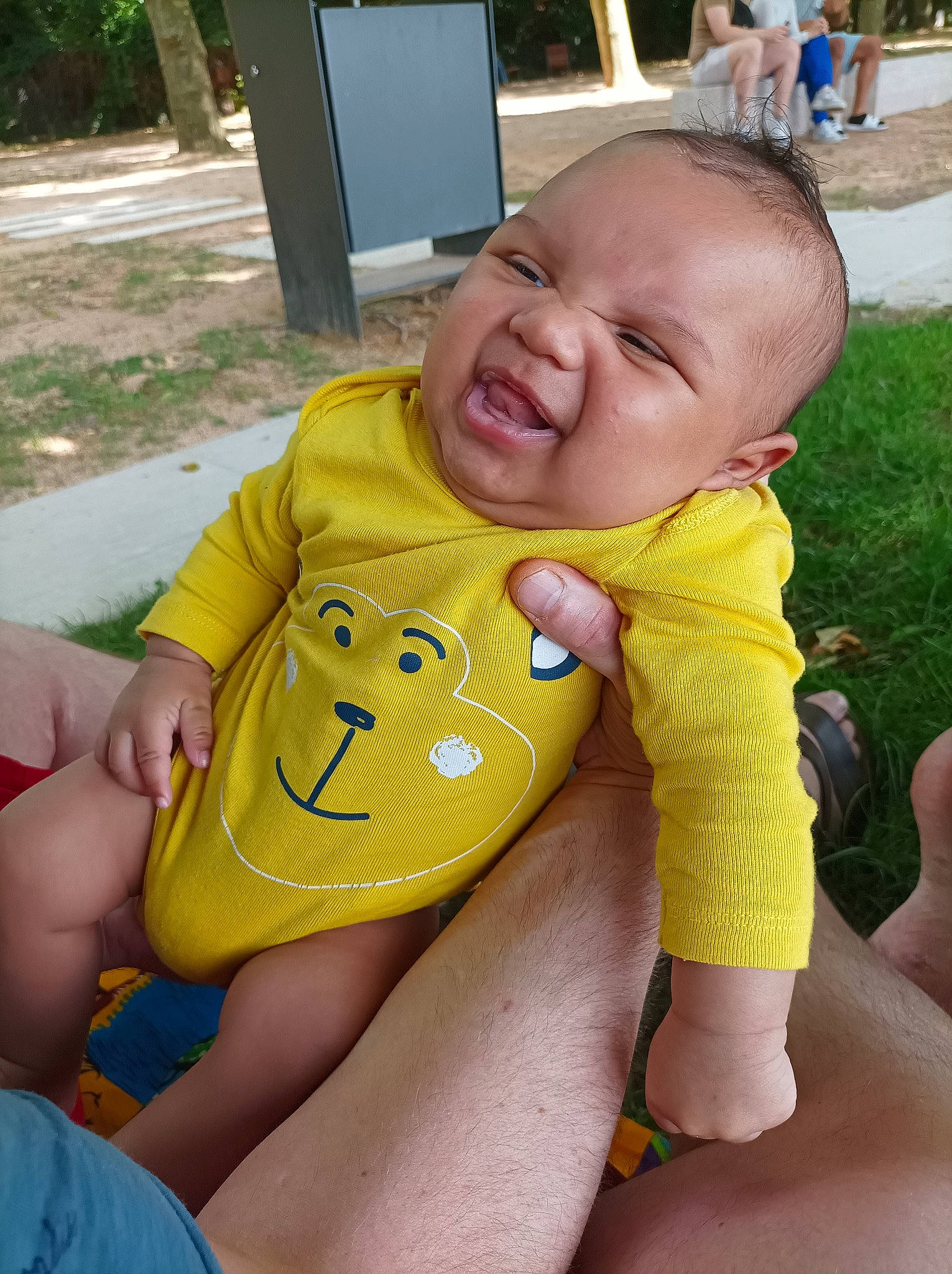Joshua participe au concours pour gagner de l'argent avec cette photo : baby, baby_toddler_clothing, chair, child, finger, fun, grass, happy, human_leg, knee, lap, leisure, person, plant, sitting, skin, smile, thigh, thumb, toddler