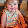 baby, background, chair, cheerful, child, closeup, colorful_clothing, eyes, face, hair_bows, happy, indoor, photography, ponytails, portrait, rosy_cheeks, sitting, smiling, striped_outfit, toddler