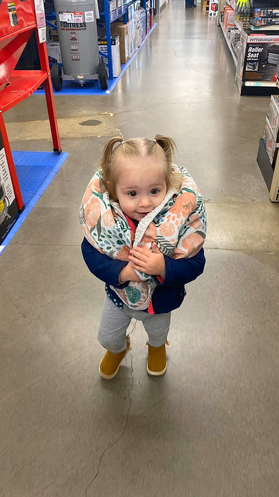 Remy joined the competition — help win amazing prizes! arm, baby, child, floor, flooring, fun, leg, person, shoe, sitting, snapshot, toddler