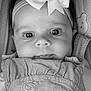 Cléophée participe au concours pour gagner de l'argent avec cette photo : baby, black_and_white, blanket, bow, child, close_up, clothing, cute, eyes, fabric, face, headband, infant, lying_down, pattern, portrait, smiling, soft, texture, young
