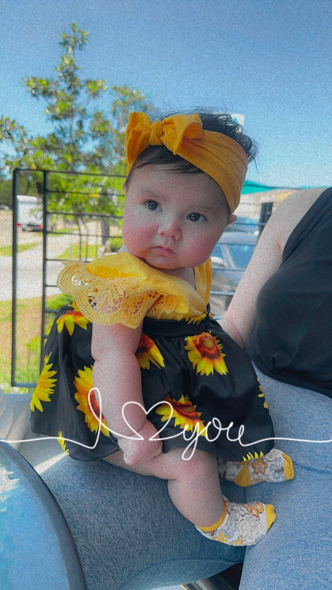 Joey is registered to the contest to win money with this photo: auto_part, baby, baby_products, baby_toddler_clothing, cap, child, costume_hat, fashion_accessory, fun, grass, happy, hat, headwear, leisure, person, plant, recreation, sitting, sky, toddler