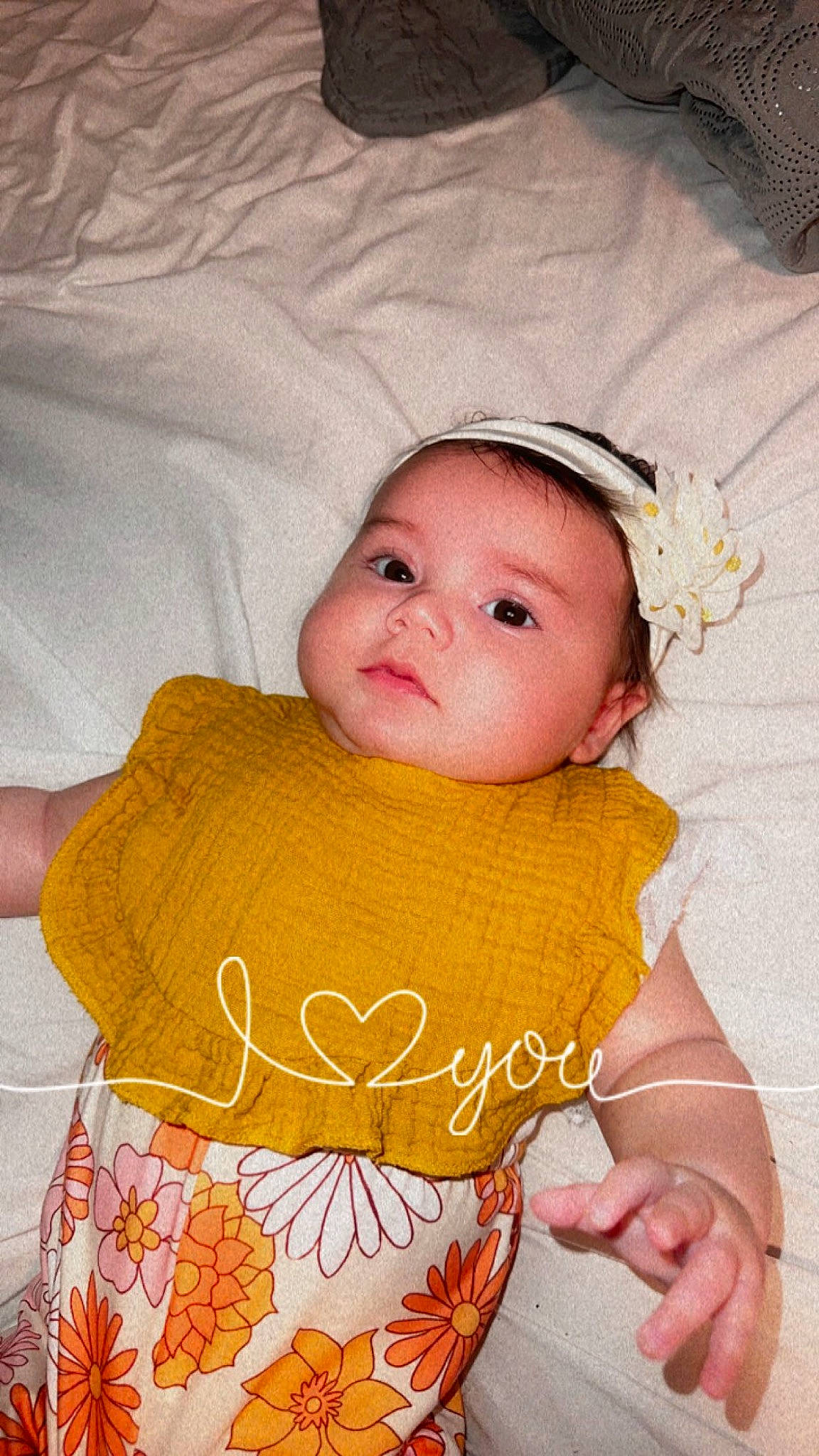 Joey joined the competition — help win amazing prizes! baby, baby_products, baby_toddler_clothing, cheek, child, comfort, dress, eye, happy, headgear, iris, linens, lip, pattern, peach, person, pink, skin, sleeve, toddler