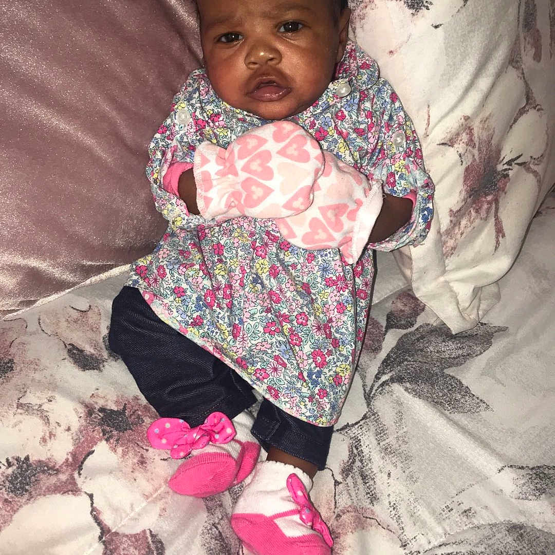 Sevyn is registered to the contest to win money with this photo: baby, bed, bedroom, blanket, clothing, couch, cushion, face, furniture, happy, head, homedecor, indoors, newborn, pants, person, photography, portrait, quilt, room