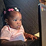 Paris joined the competition — help win amazing prizes! baby, child, laptop, couch, hair_clips, pink_shirt, indoor, window, sunlight, typing, curly_hair, earrings, technology, focused, young_child, furniture, home, person, black_hair, cute