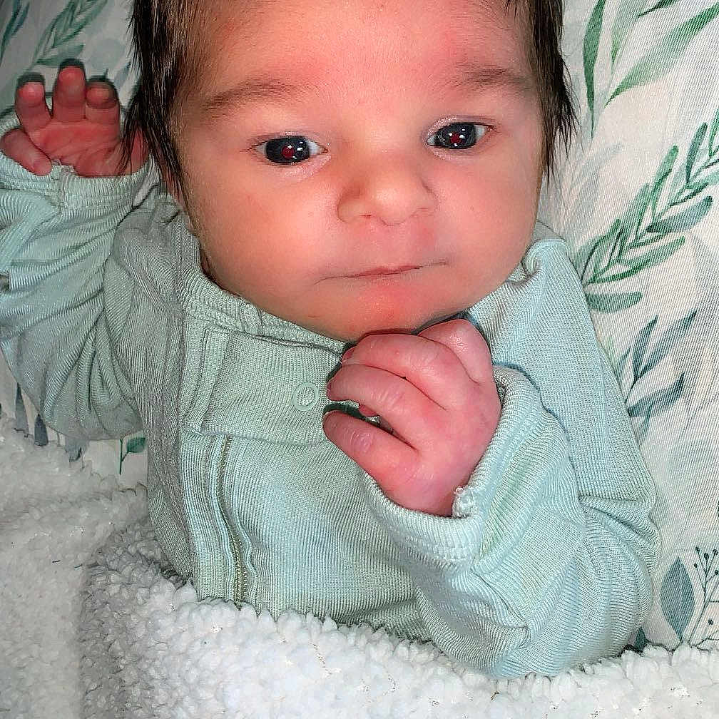 Atlas is registered to the contest to win money with this photo: baby, bed, bedroom, blanket, bodypart, cushion, face, finger, furniture, hand, happy, head, homedecor, indoors, newborn, person, photography, portrait, quilt, smile