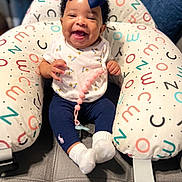 Jerrial is registered to the contest to win money with this photo: baby, babylaughing, clothing, costume, couch, cushion, face, furniture, happy, hat, head, homedecor, hosiery, laughing, pants, people, person, photography, portrait, sock