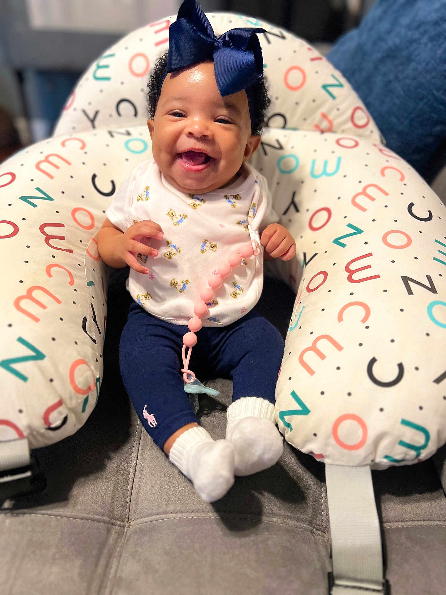 Jerrial is registered to the contest to win money with this photo: baby, babylaughing, clothing, costume, couch, cushion, face, furniture, happy, hat, head, homedecor, hosiery, laughing, pants, people, person, photography, portrait, sock